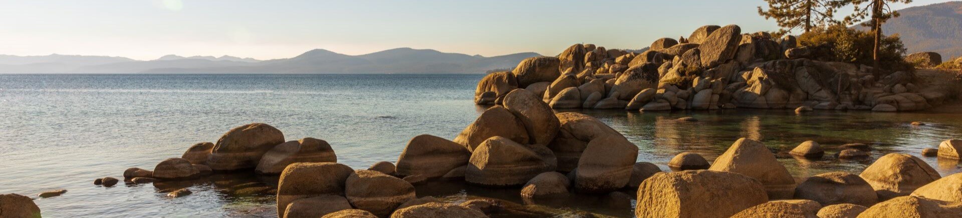 Tranquil landscape of Lake Tahoe featuring rocky shores